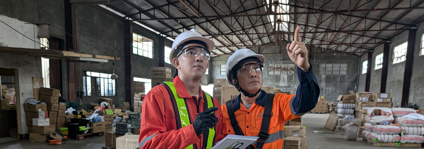 Safety workers in warehouse